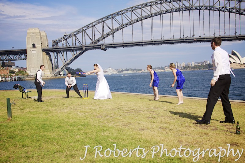 Bridal party playing backyard cricket on Sydney Habour Foreshore - wedding photography sydney